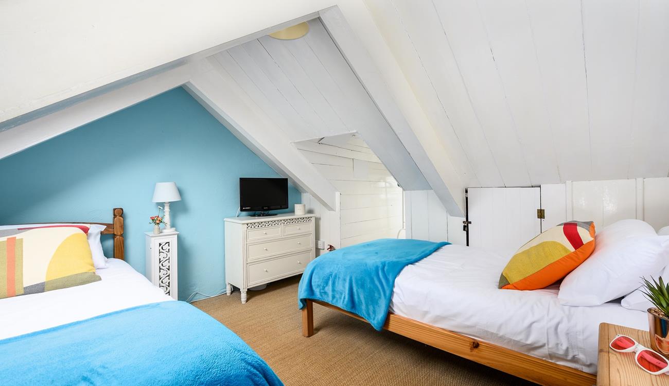 The attic room has twin beds for snuggling up after days spent adventuring.