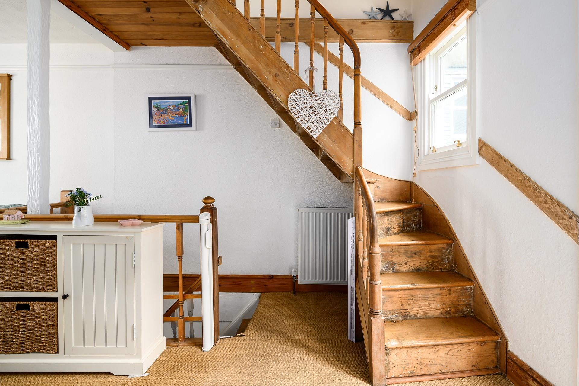 Climb the stairs to bed after a busy day exploring the Cornish coastline.