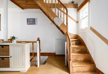 Climb the stairs to bed after a busy day exploring the Cornish coastline.