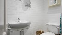 The shower room has a basin, WC and a shower enclosure. 