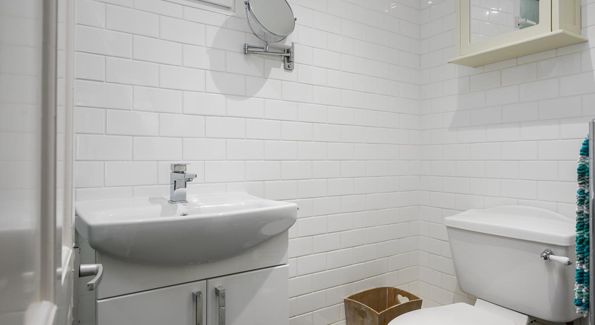 The shower room has a basin, WC and a shower enclosure. 