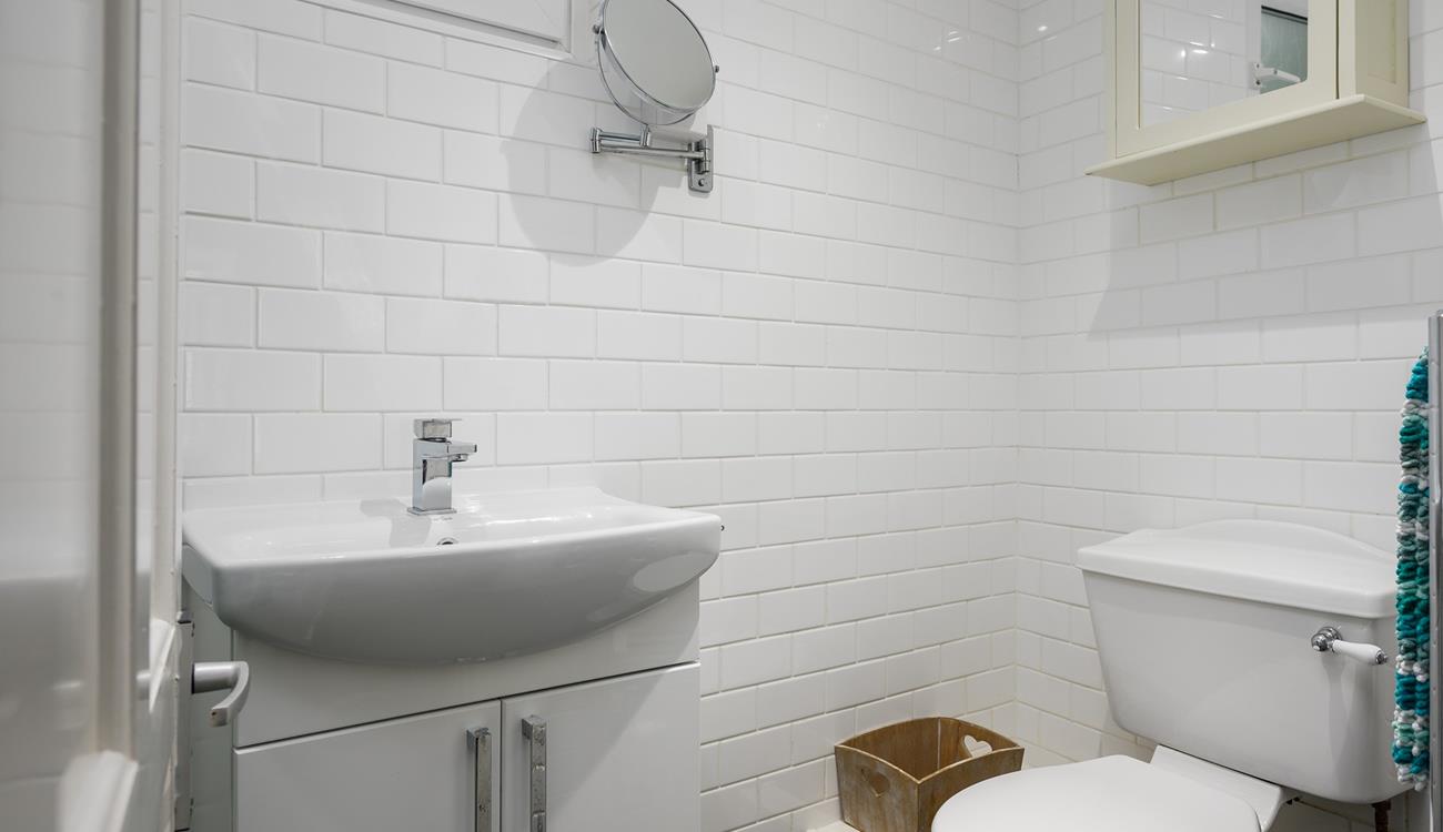 The shower room has a basin, WC and a shower enclosure. 