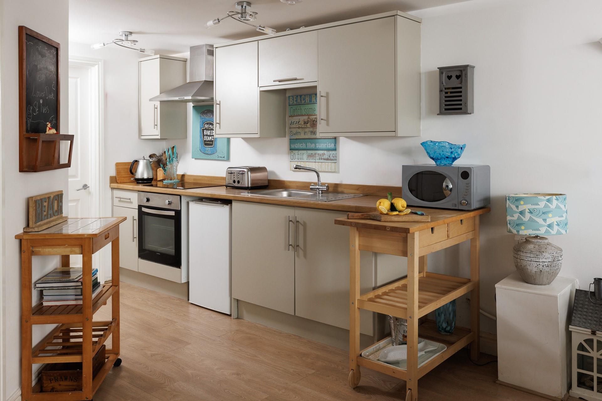 The compact yet well-equipped kitchen is perfect for rustling up delicious meals.