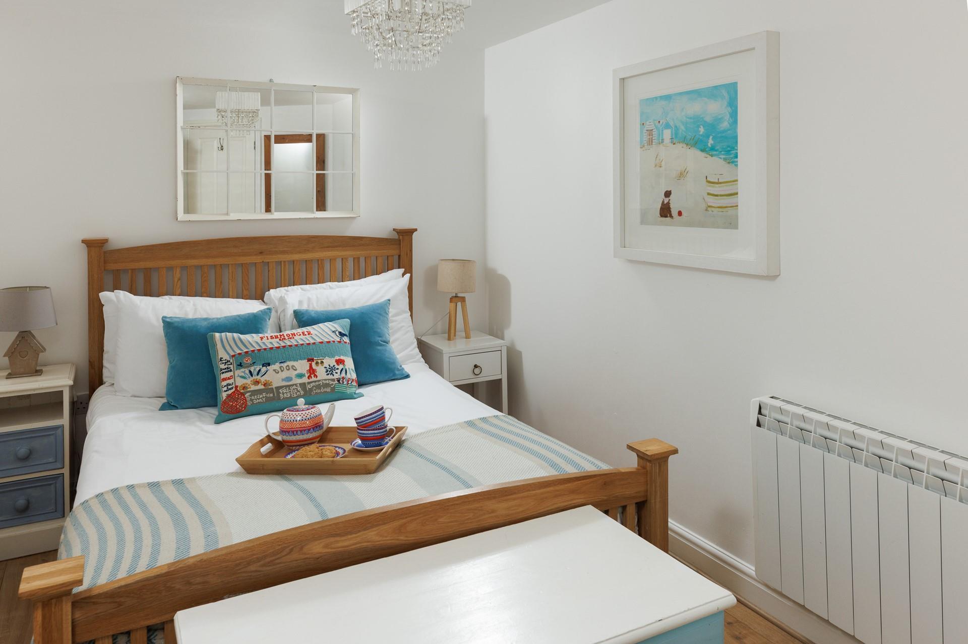 The bedroom offers a soothing and stylish space to unwind after a busy day.