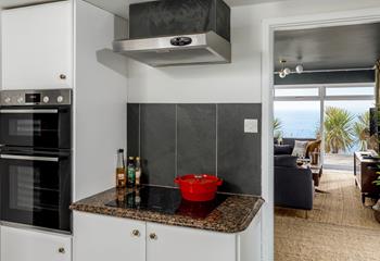The utility area has an extra oven and hob for all your cooking needs.