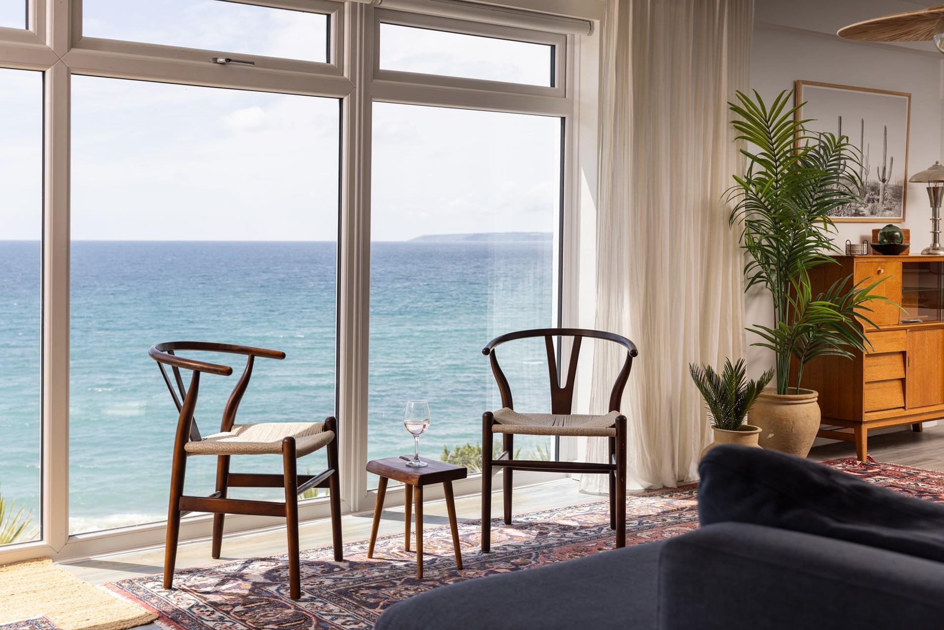 Treat yourself to a glass of something chilled, with the ocean as your backdrop.