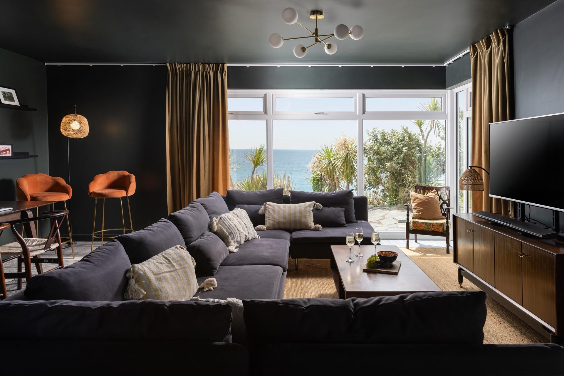 The second spacious sitting room has a 50" TV with sound bar, full Sky package with sports and movies, and of course, fantastic sea views. 