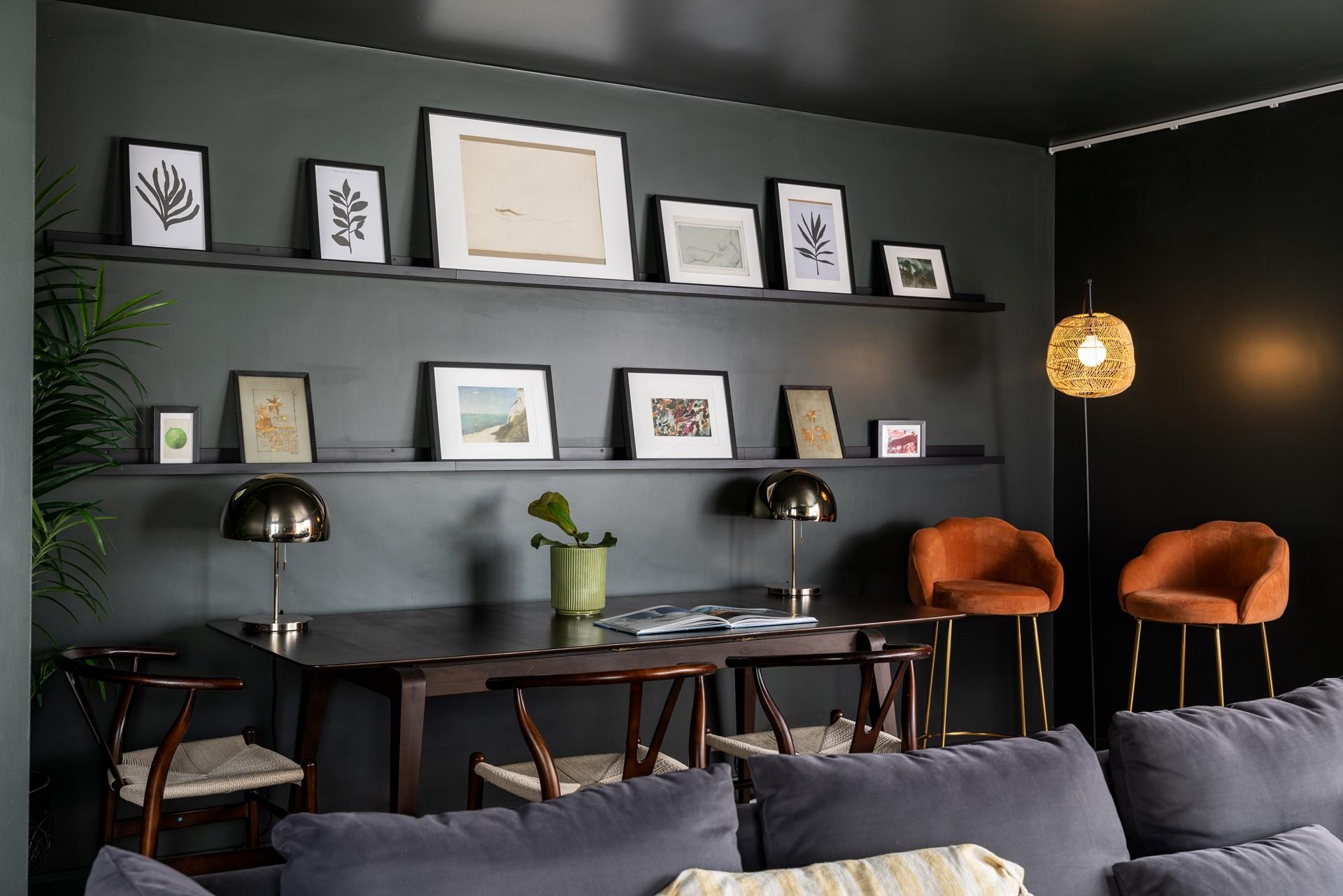 Contemporary coastal artwork adorns the second sitting room.