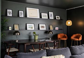 Contemporary coastal artwork adorns the second sitting room.