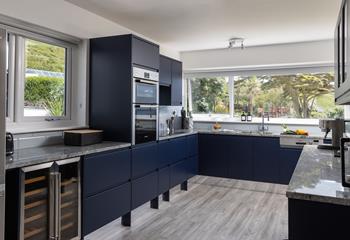 Overlooking the gardens and clifftops, the kitchen is spacious and well-equipped.