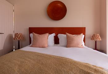 The pale hues create a calming bedroom where you'll sleep soundly.