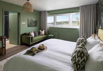 Opulent decor creates a calming space, reflecting the deep greens of the coastal landscape.