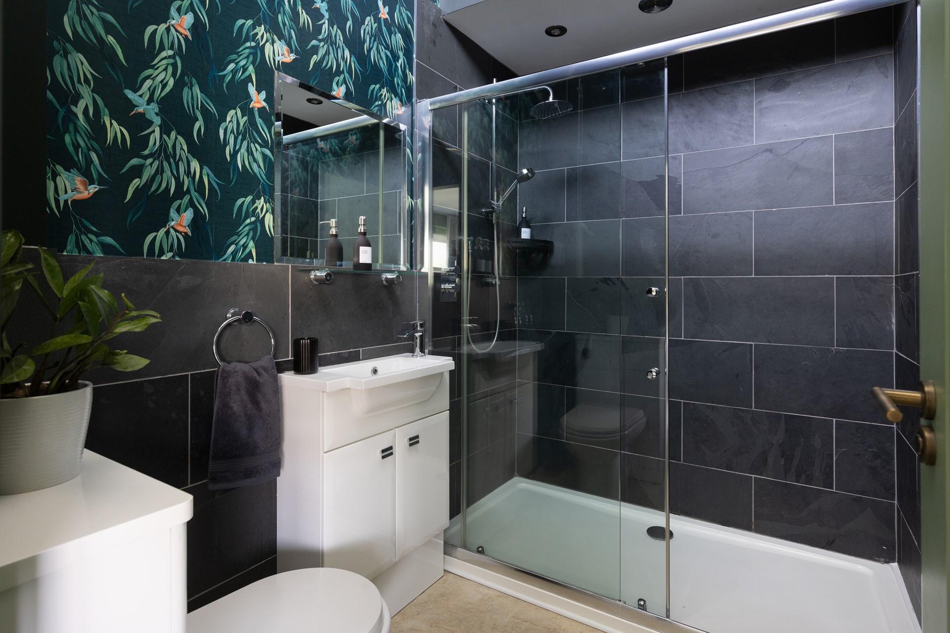 Bedroom 2 has a beautiful en suite with a double walk-in shower.