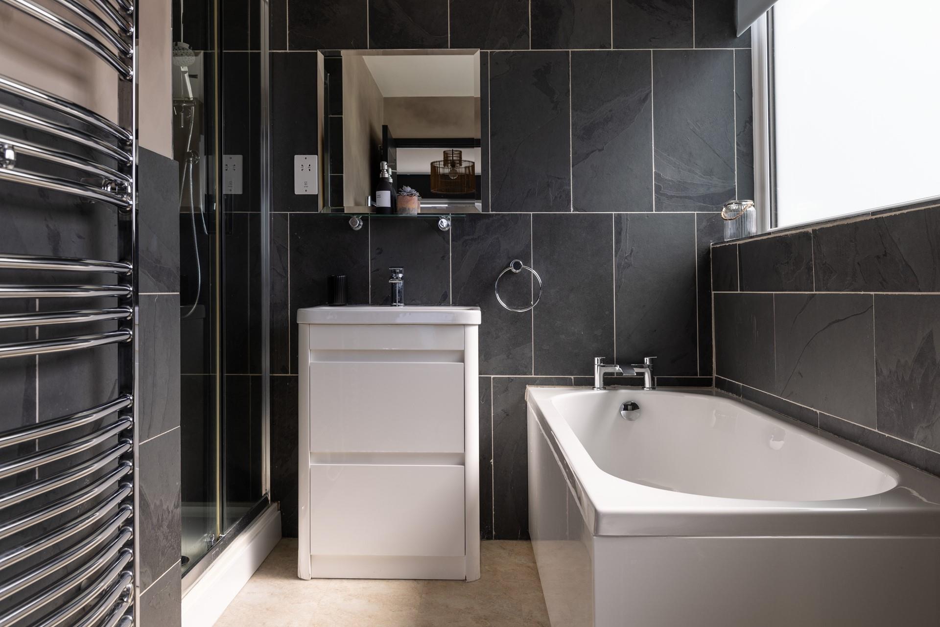 There's also a bath in the en suite, perfect for soaking after a day walking the coast path.