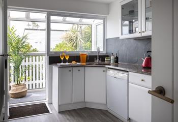 The second kitchen is well-equipped to prepare drinks and nibbles for around the pool.