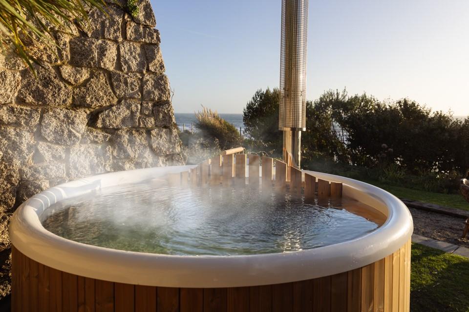 Spend evenings in the wood-fired hot tub, taking in the views!
