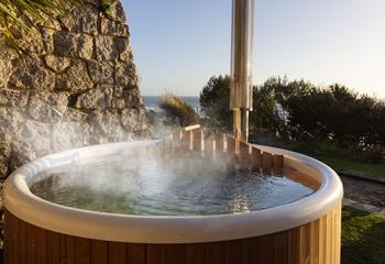 Spend evenings in the wood-fired hot tub, taking in the views!