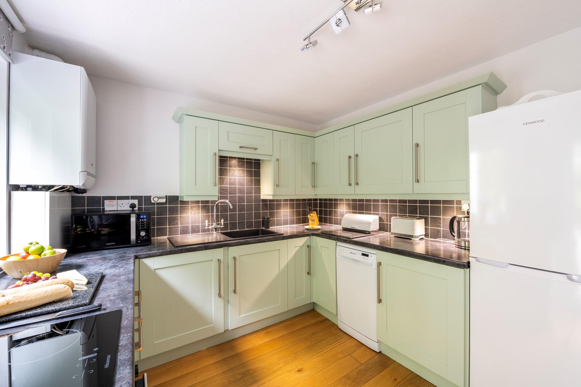 The kitchen is well-equipped for cooking up a storm for the whole family.