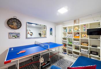The games room is equipped with a table tennis table, TV and Wii, a selection of games and a sofa. Perfect for those rainy days!
