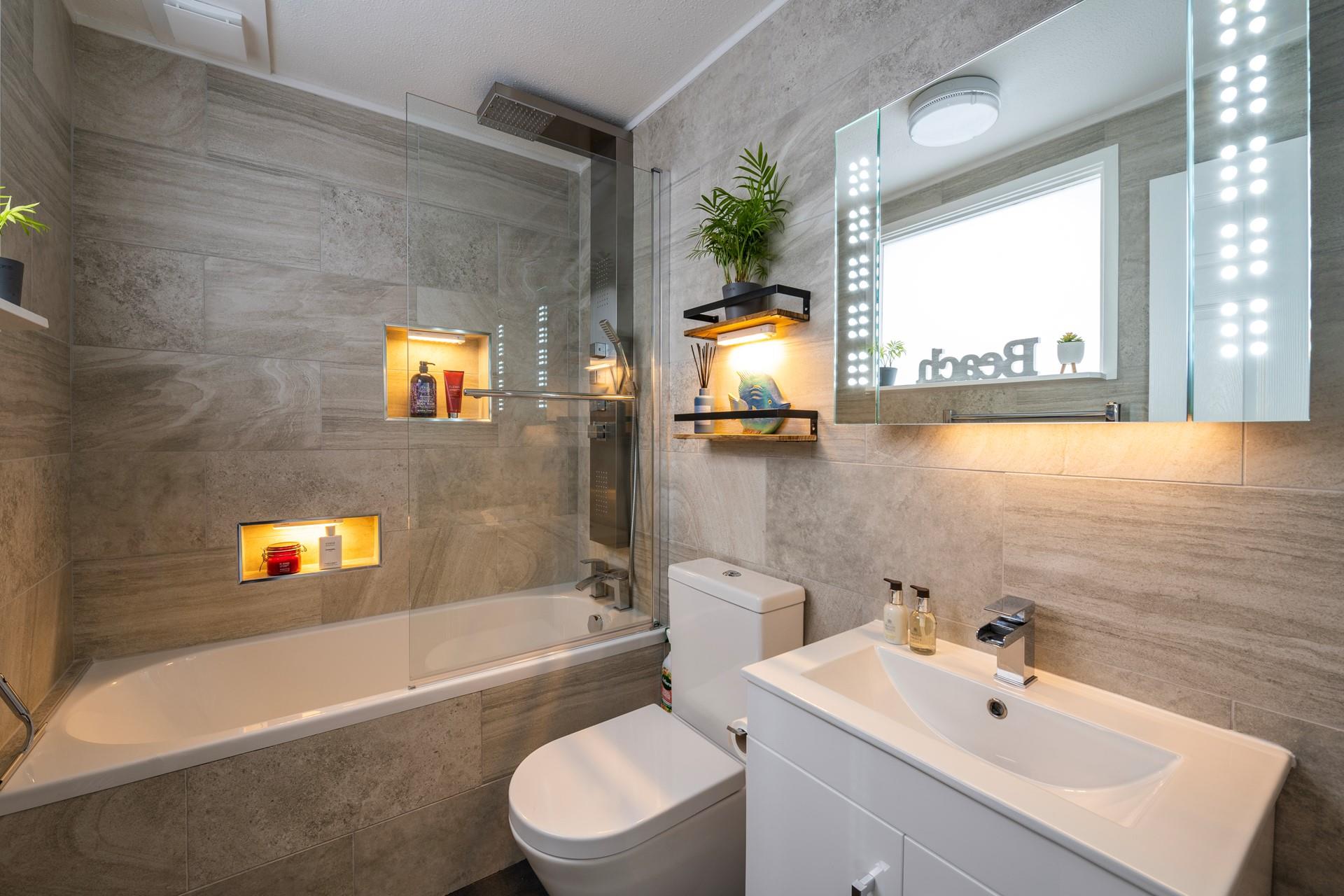 Wash off sandy toes in the shower after spending a day on the beach.