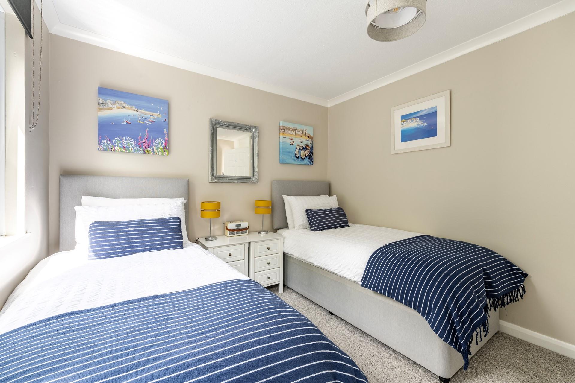 Bedroom 2 has cosy twin beds perfect for adults or children.