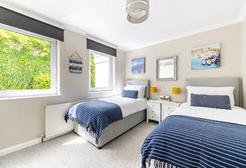 Bedroom 2 is decorated with sea blues and Cornish landscapes.