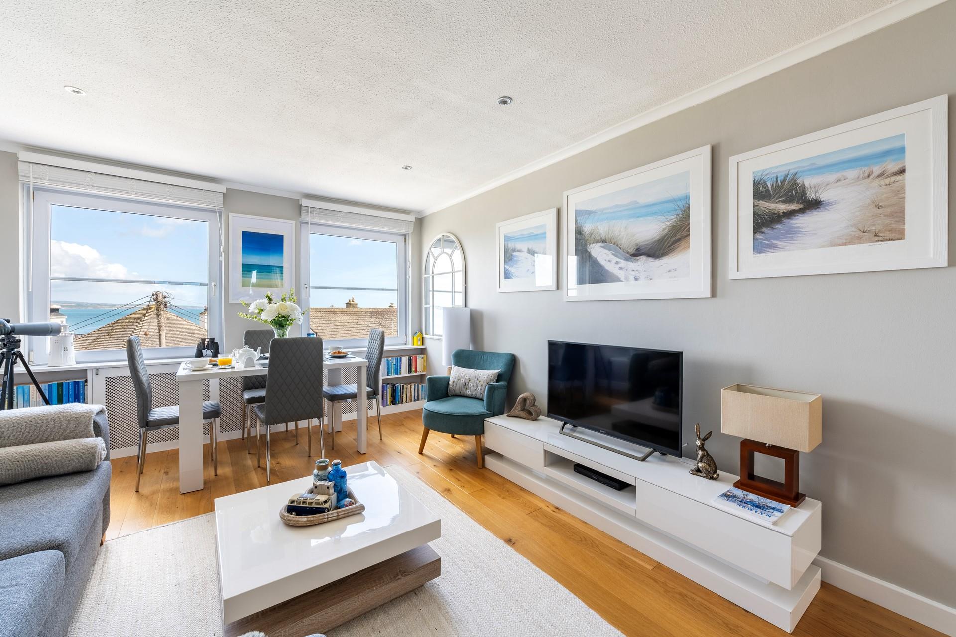 Start the day with breakfast around the stylish dining table with gorgeous sea views.