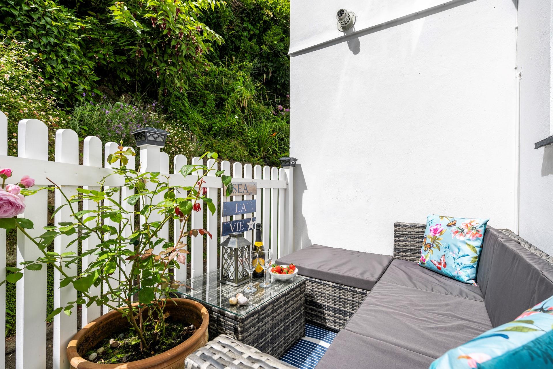 Unwind on the rattan furniture in the evening after a day on the beach.