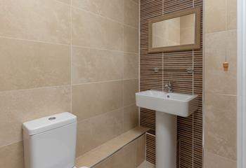 Stylish tiles give the bathroom a spa-like feel, perfect for pampering yourself.