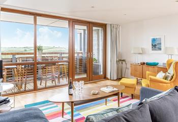 Bright tones, large windows and balcony doors have created a bright and airy living space.