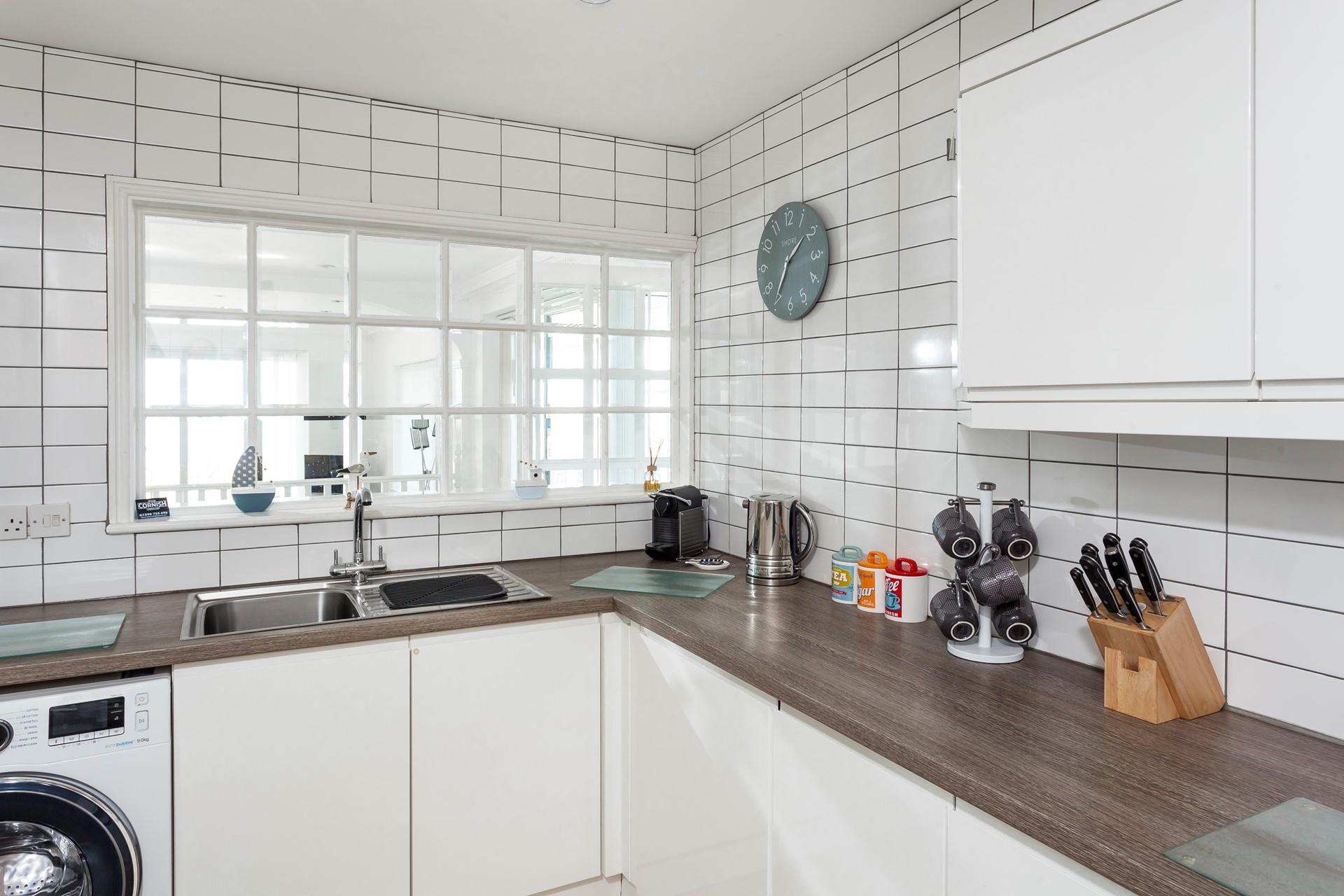 Bright and airy, the kitchen is an enjoyable space to prepare a picnic for the day. 