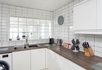 Bright and airy, the kitchen is an enjoyable space to prepare a picnic for the day. 