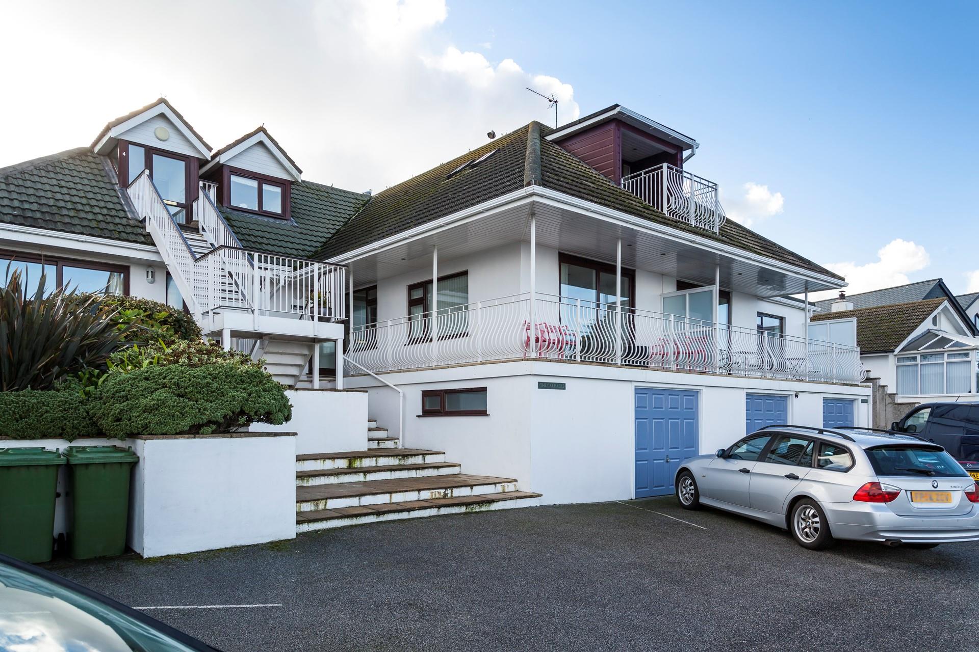 The driveway has one allocated parking space for guests. 