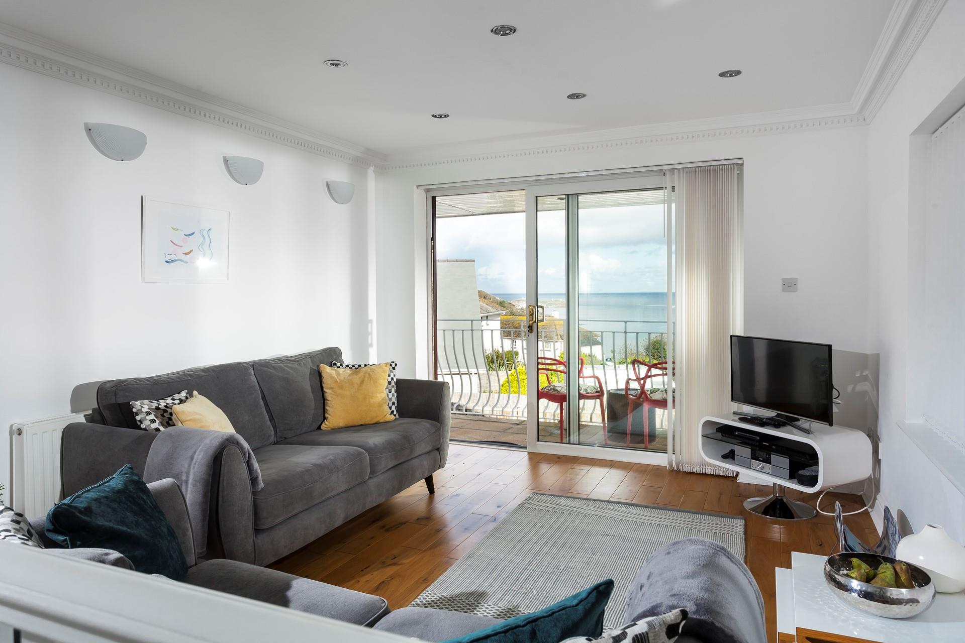 Throw open the patio doors and let the sea breeze drift into the modern living space. 