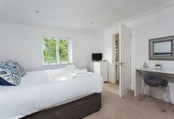 Light and spacious, bedroom 2 is a calming space, perfect for relaxing after a busy day out. 