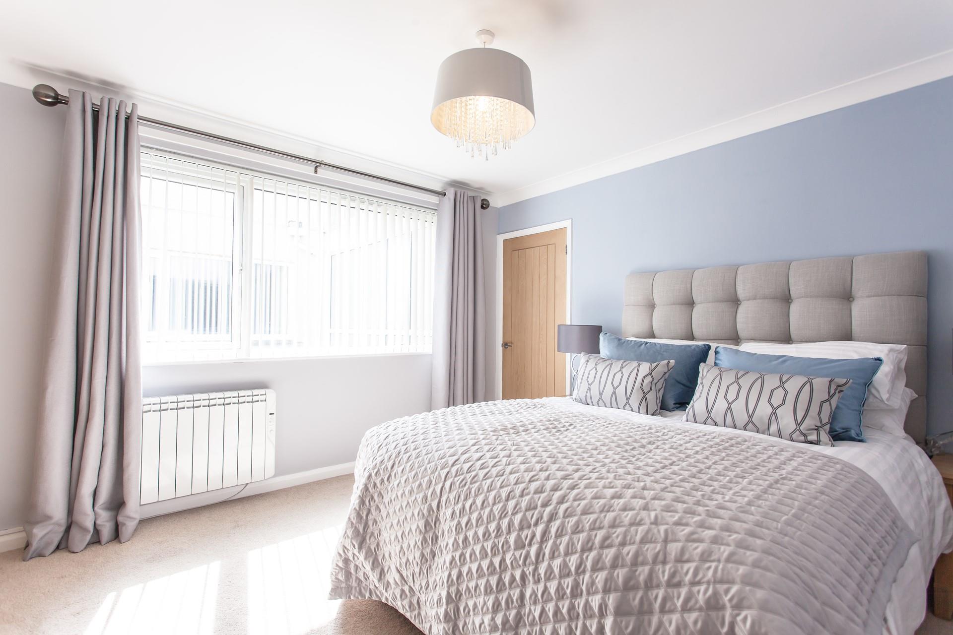 The king size room is luxurious and spacious with plenty of natural light. 