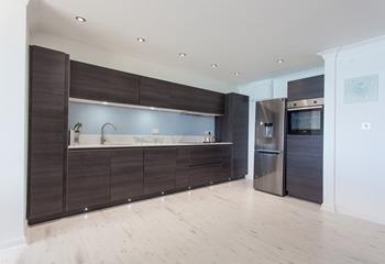You'll enjoy cooking up a feast in the contemporary kitchen. 