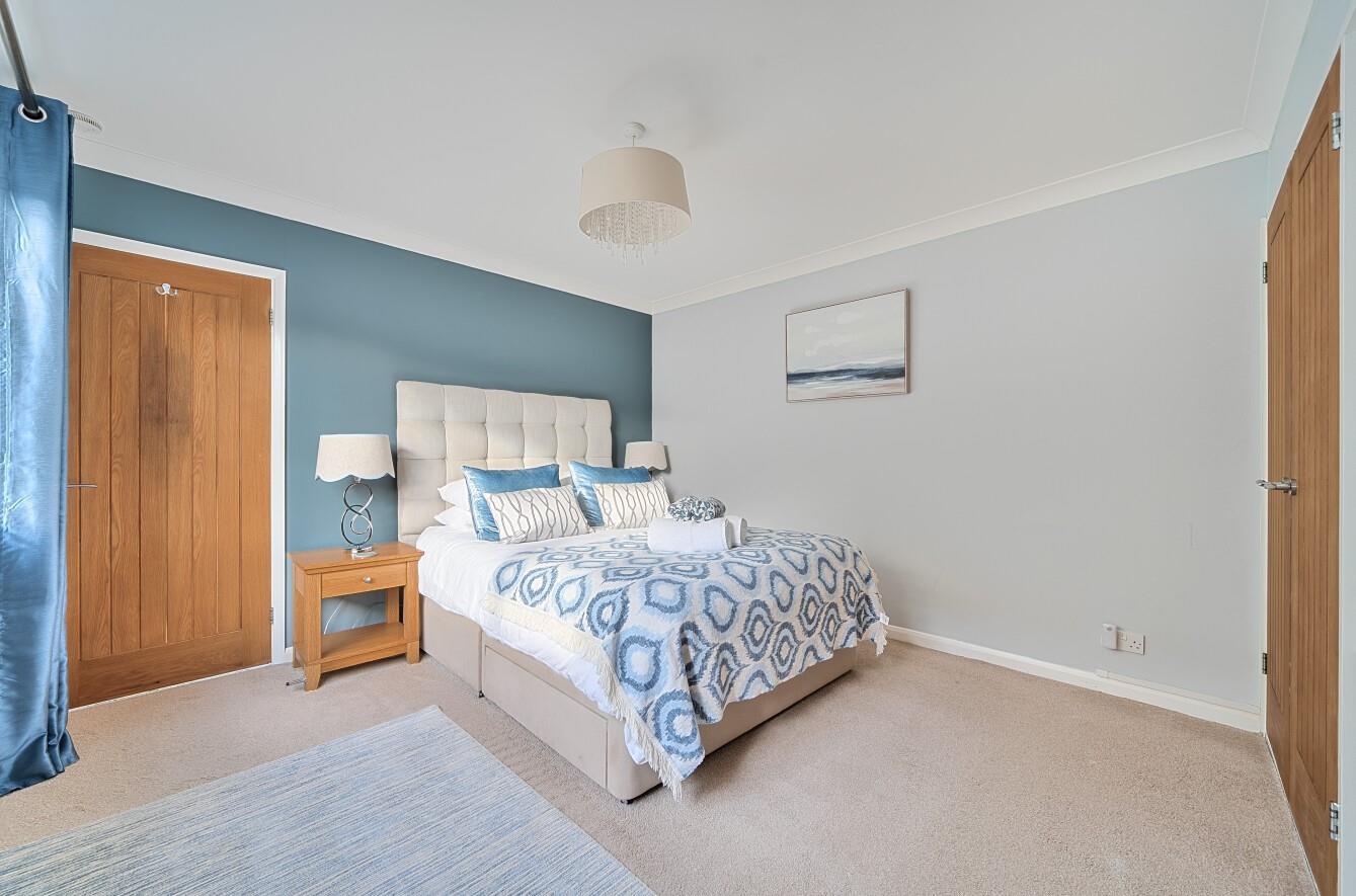 The bedrooms are decorated with calming coastal blues.