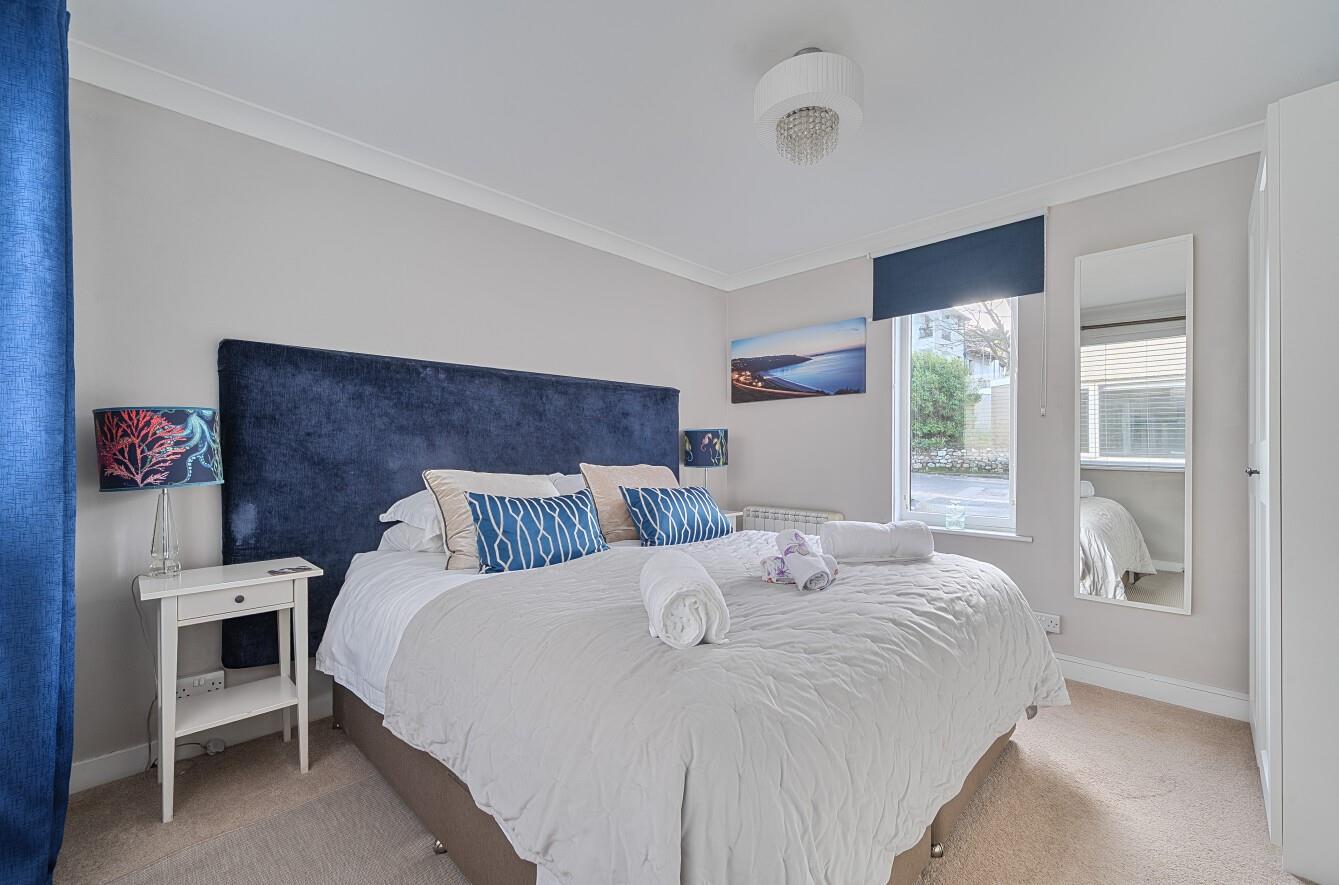 The king size room is luxurious and spacious with plenty of natural light. 