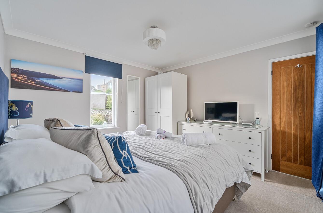 Enjoy a relaxing night's slumber in the king size bed.