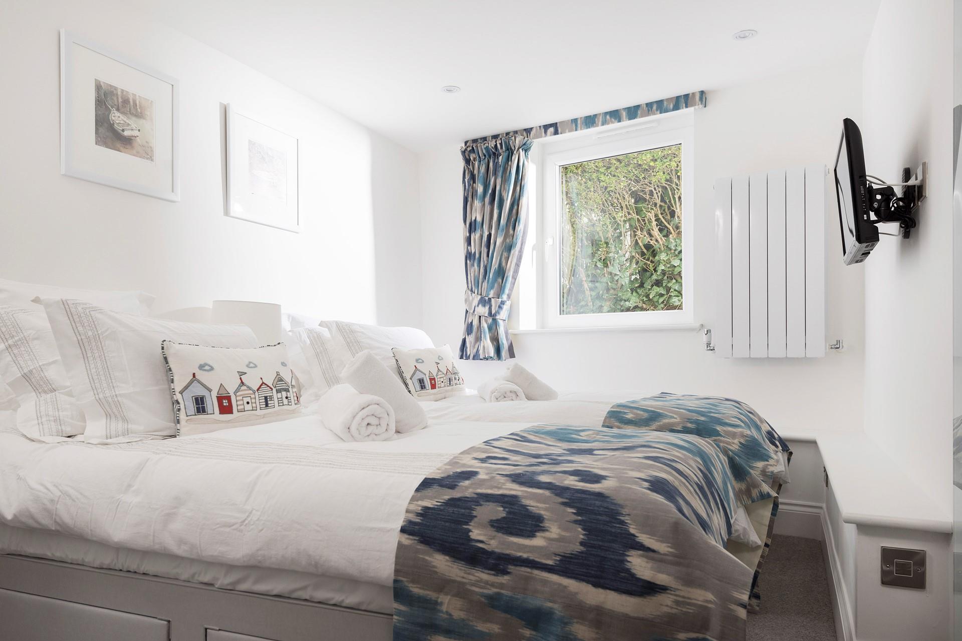 The coastal feel continues in bedroom 2.