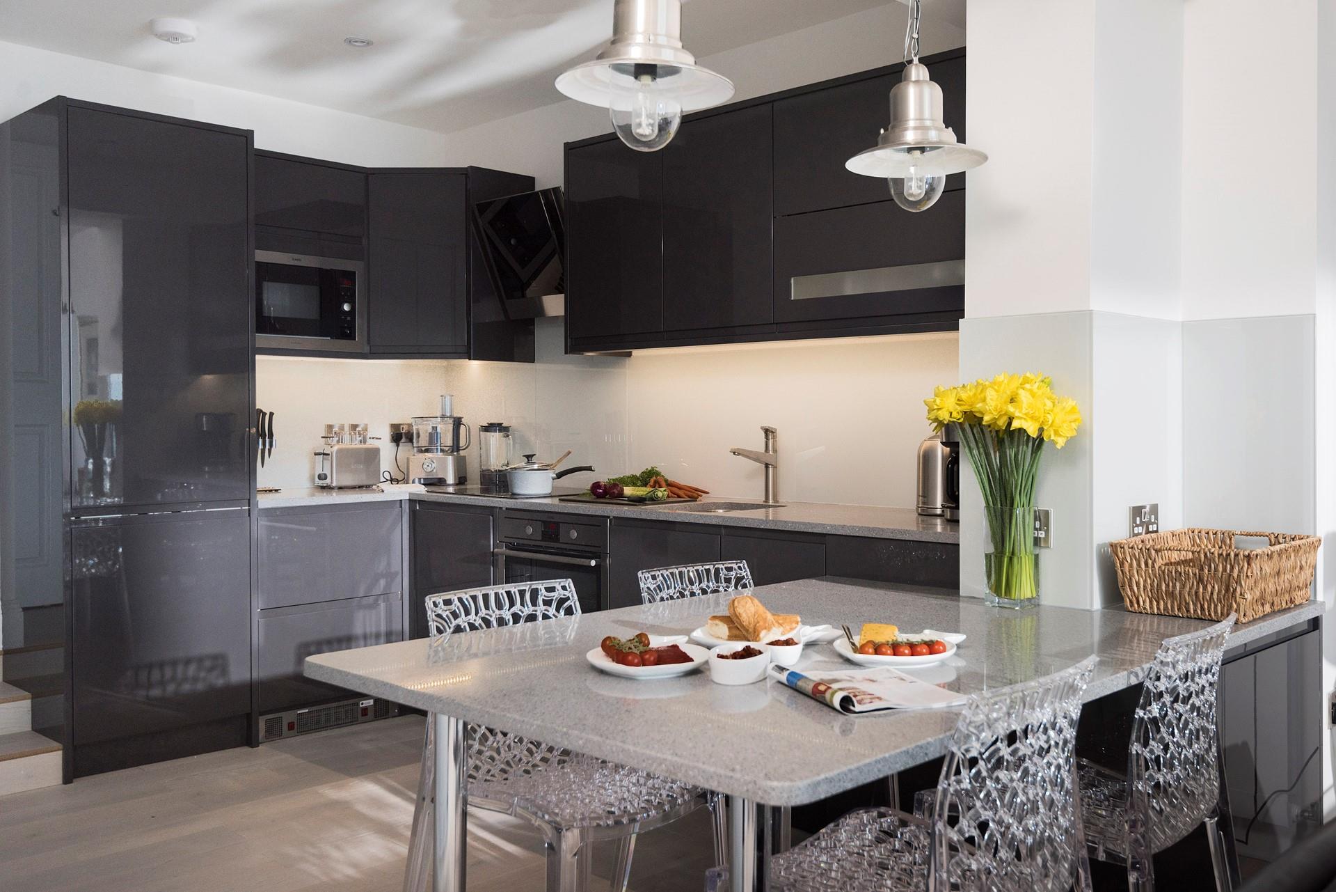 The ultra-sleek and modern kitchen features all the mod-cons you need.