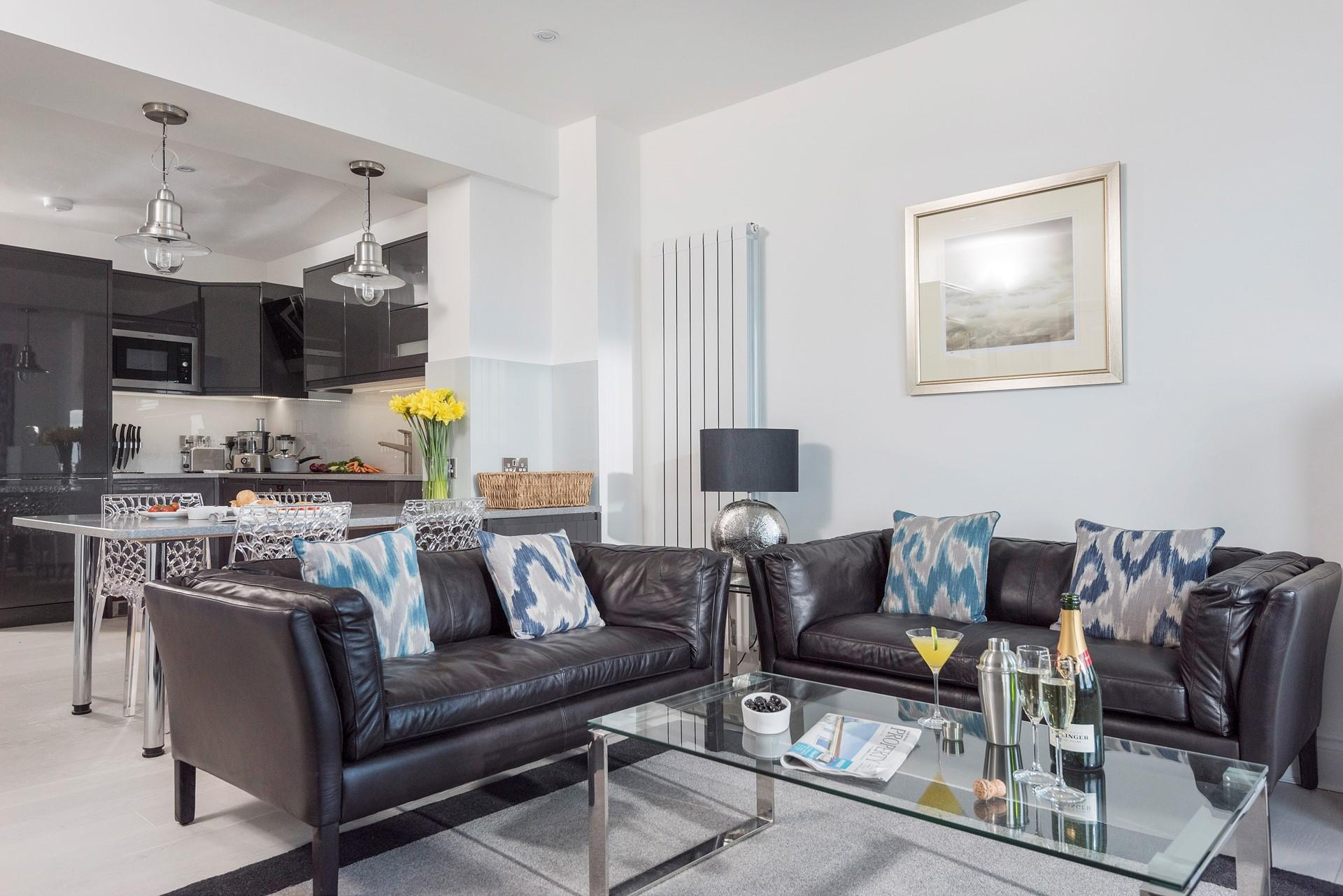 Elegantly designed, the open plan living area benefits from natural light streaming in through the large bay window. 