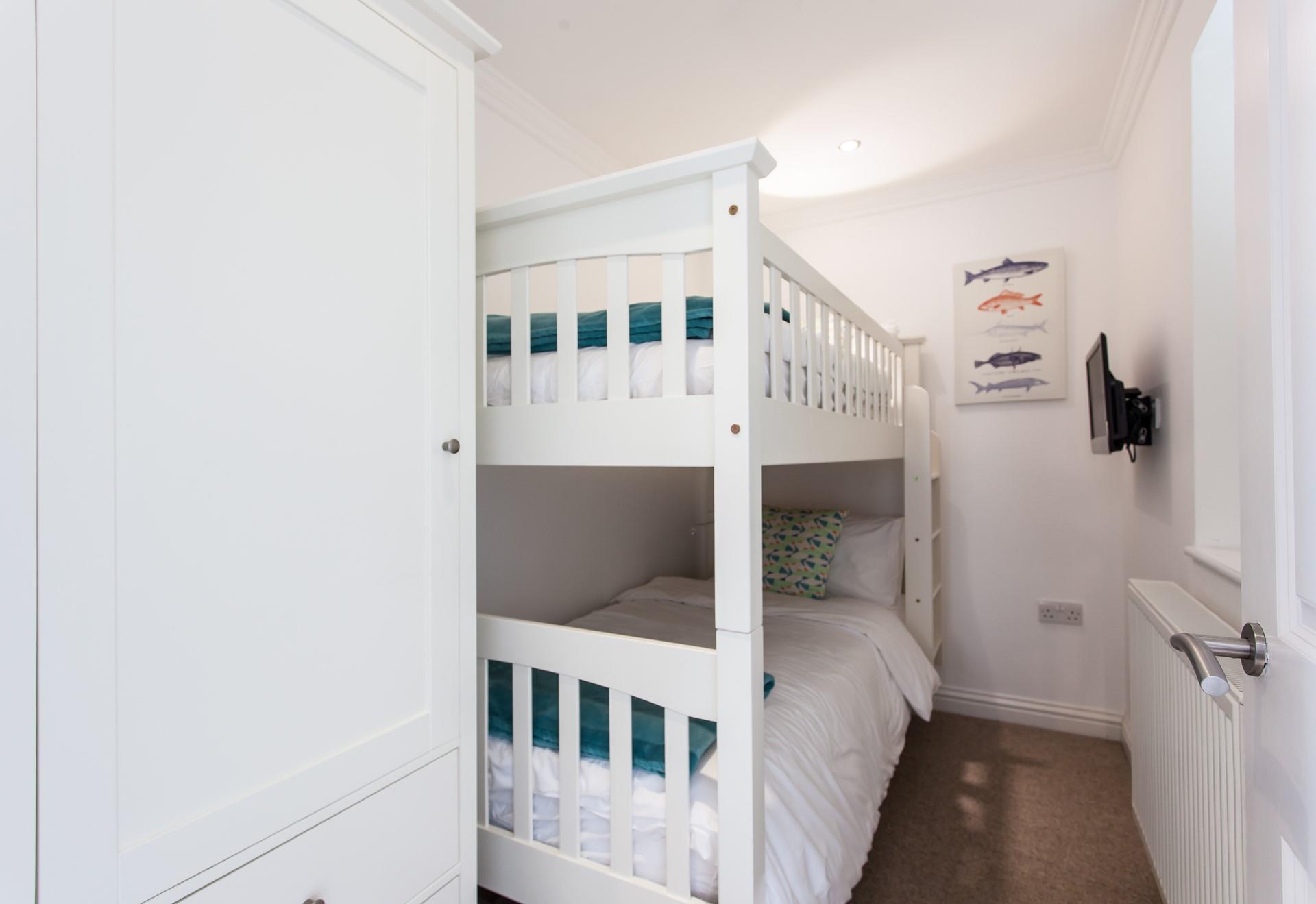 Bunk beds and their own TV is sure to delight children.