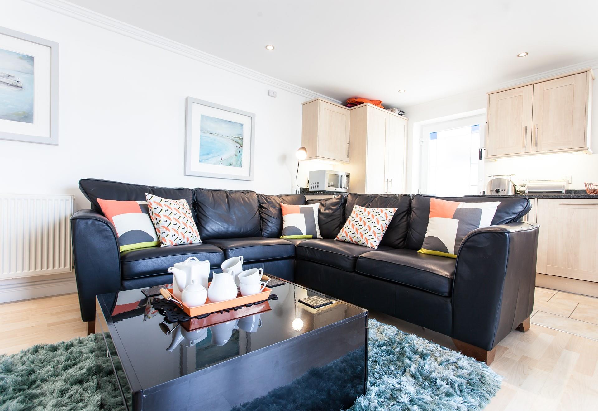 The sleek sofa offers plenty of space for everyone to snuggle up.