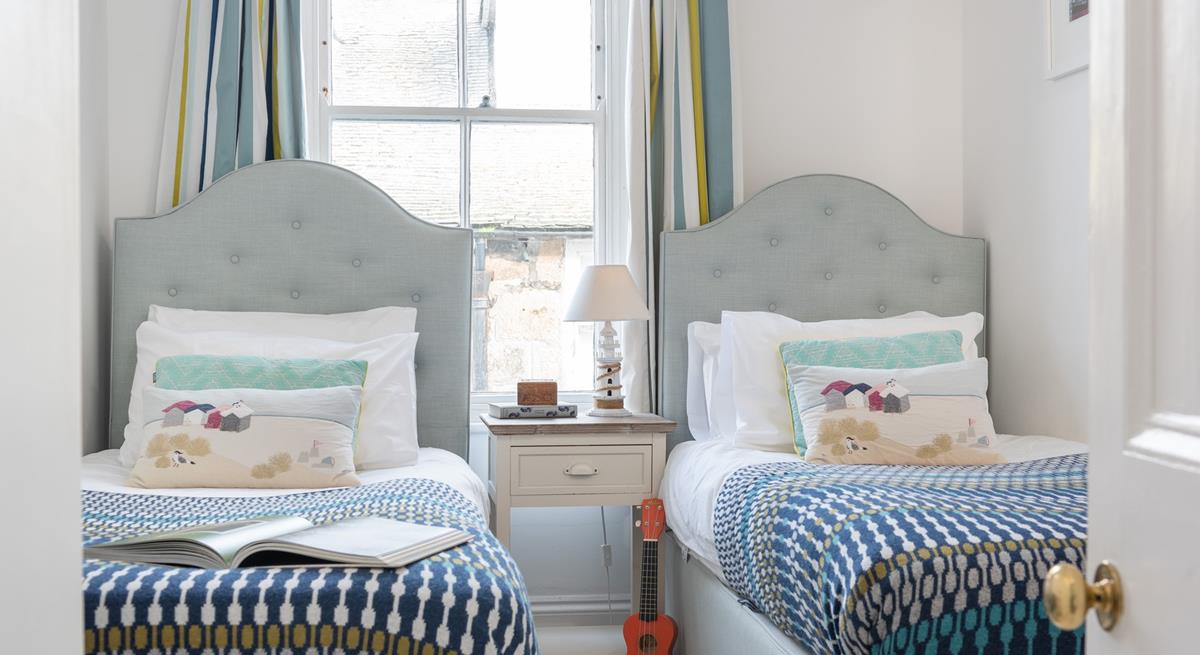 The twin beds are perfect for kids or adults to settle into.