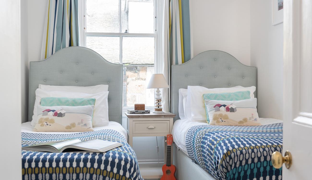 The twin beds are perfect for kids or adults to settle into.