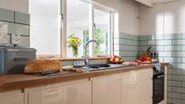 The modern kitchen is well-equipped for the chef of the family to whip up a culinary delight.