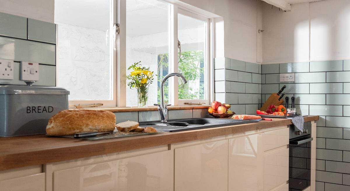 The modern kitchen is well-equipped for the chef of the family to whip up a culinary delight.