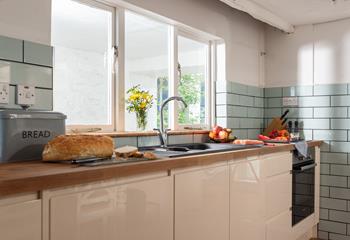The modern kitchen is well-equipped for the chef of the family to whip up a culinary delight.
